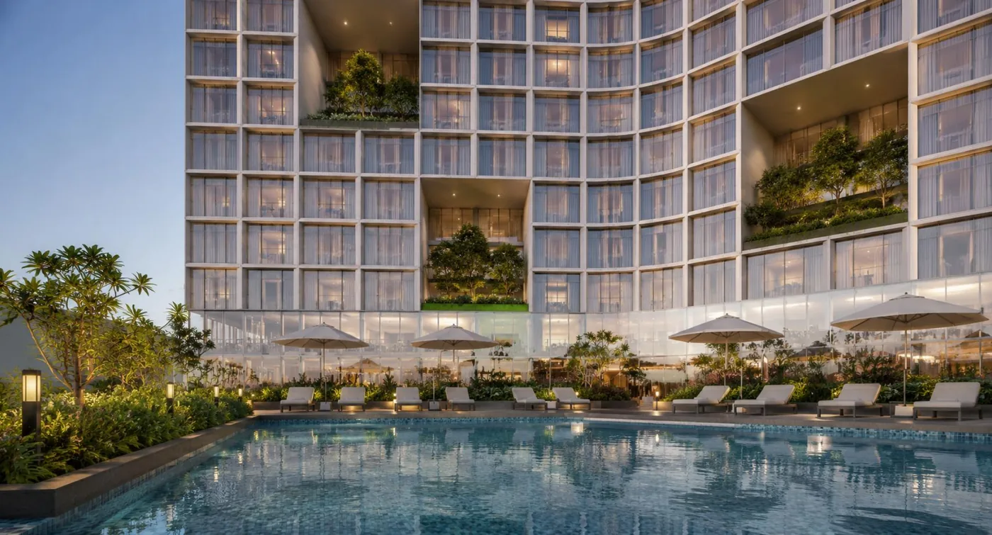 Pool deck at the DoubleTree by Hilton in Al-Safa Tower at dusk, with loungers, umbrellas and the louvered guest-room facade rising above